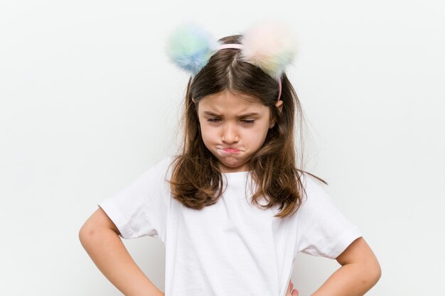 Little girl with costume and accessories having fun