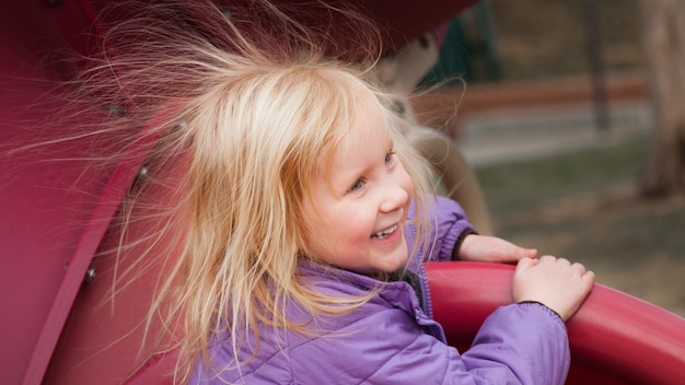 Little girl with crazy hair style.