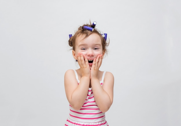 Little girl with curlers on her head