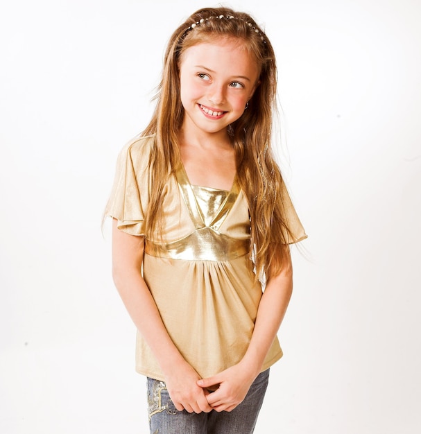 Little girl with cute smile over white background