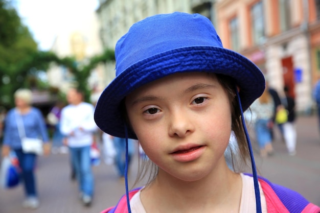 Little girl with down syndrome in the city