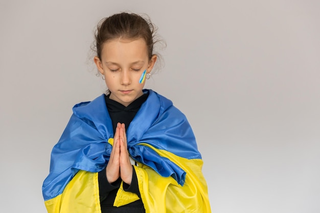 Little girl with the flag of Ukraine