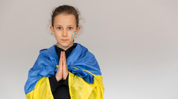 Little girl with the flag of Ukraine