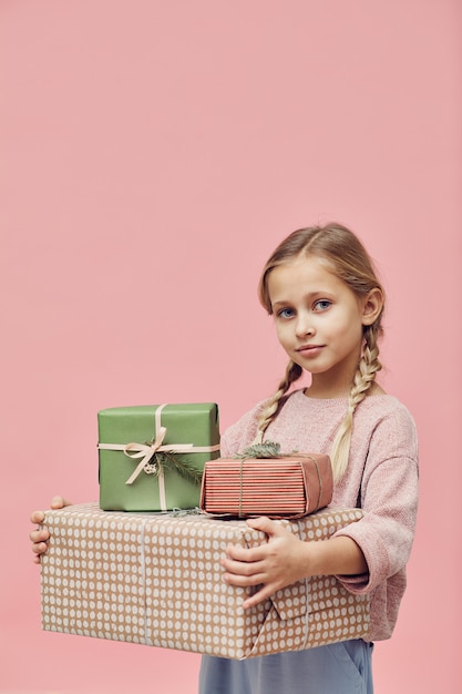 Little girl with gift boxes