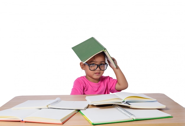 Little girl with glasses thought and many book on the table.