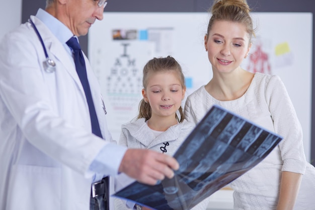 Little girl with her mother at a doctor on consultation