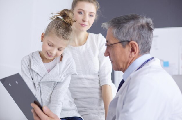 Little girl with her mother at a doctor on consultation