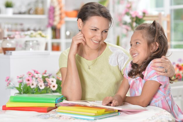 Little girl with her mother doing homework