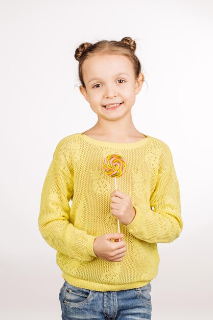 Little girl with lollipops