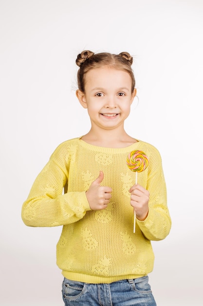 Little girl with lollipops