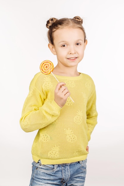 Little girl with lollipops