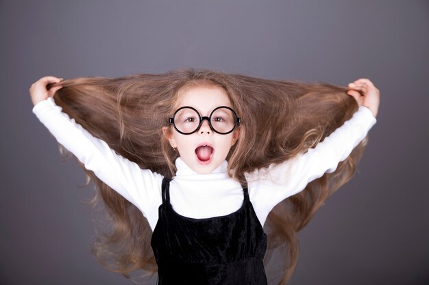 Little girl with long hair.