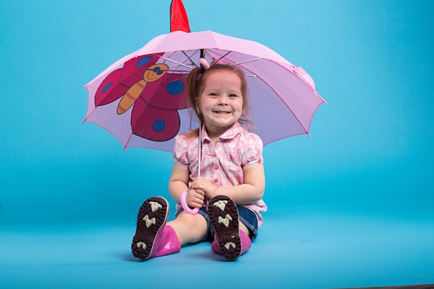 Little girl with pink umbrella