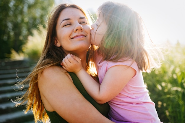 Little girl with special needs enjoy spending time with mother in nature