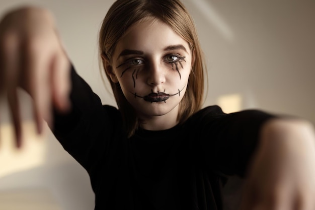 Little girl with spooky Halloween makeup