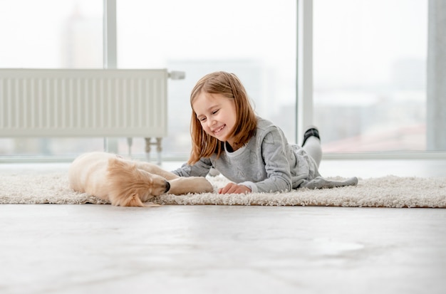 Little girl with young dog