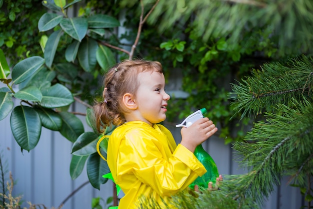 little girl in a yellow raincoat