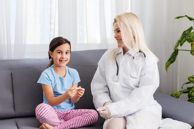 Little girl and young doctor in hospital