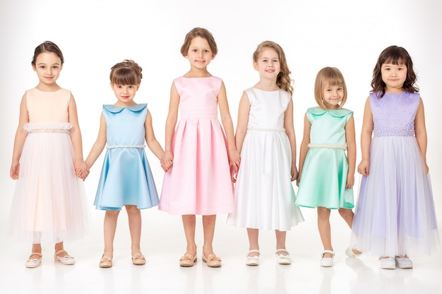 Little girls in dresses of princesses