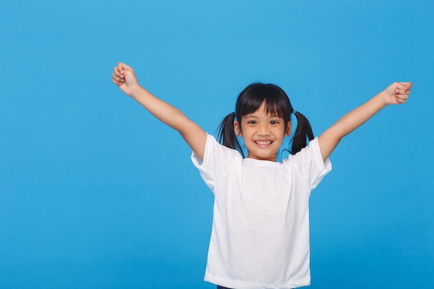 Little girls raising her two hands up