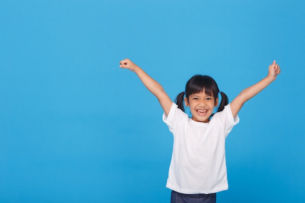 Little girls raising her two hands up