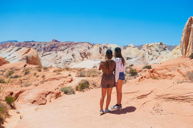 Little girls on trail at fire valley in utah