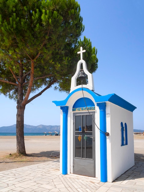 Little Greek church St Nicholas in blue and white colors of Pefki on the island Evia Greece