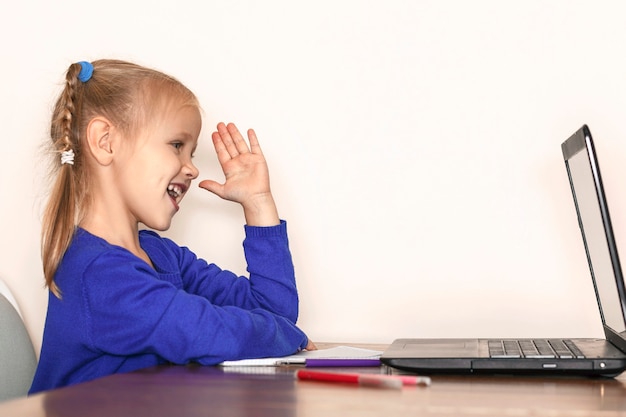 Little grirl raised her hand to answer the distance lesson