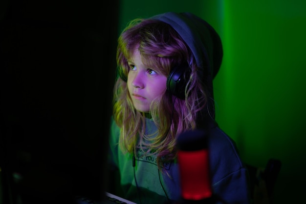 Little hacker young programmer night surf in the internet\
little child gamer play computer game on d