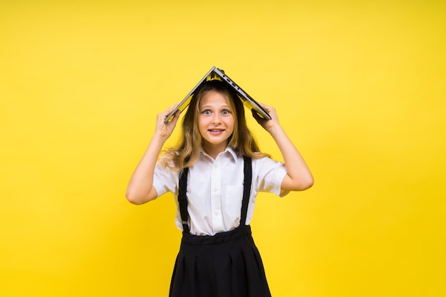 Little happy blonde kid girl 1213 years laptop pc computer Children lifestyle childhood concept