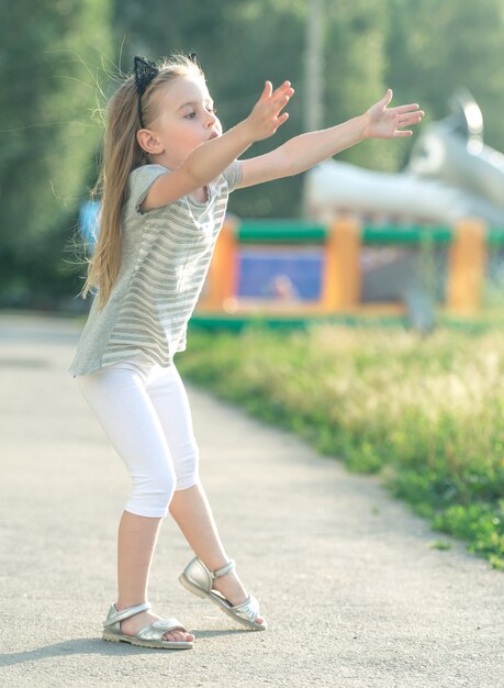 Little happy girl walking