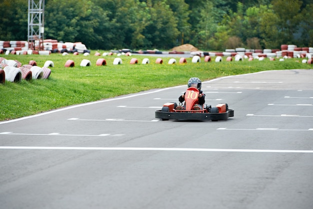 Little karting racer on the track