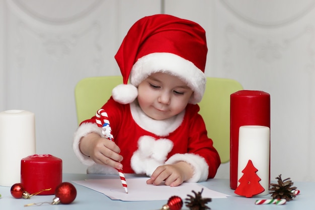 Little kid are writing letter to Santa Claus