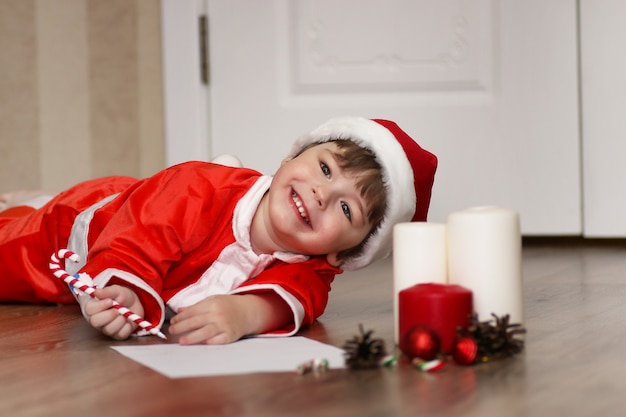 Little kid are writing letter to Santa Claus