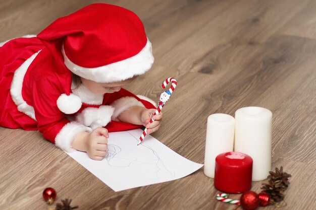 Little kid are writing letter to Santa Claus