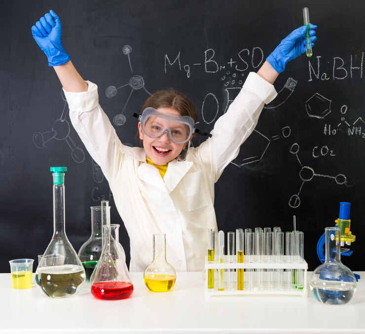 Little kid on chemistry lesson in lab