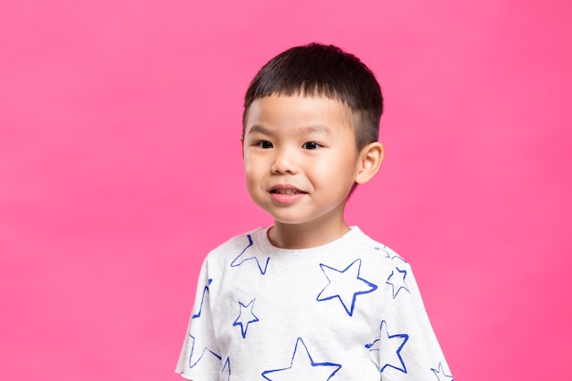 Little kid over pink background