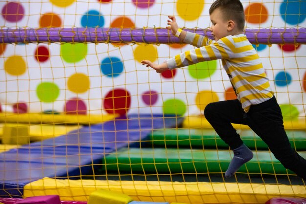 Little kid playing in kindergarten room