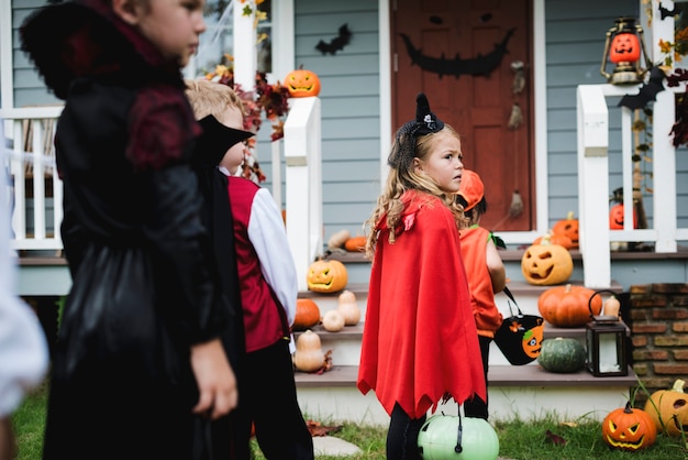 Photo little kids trick or treating