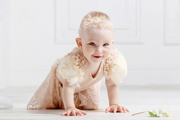 Little lovely girl  creeps on a floor