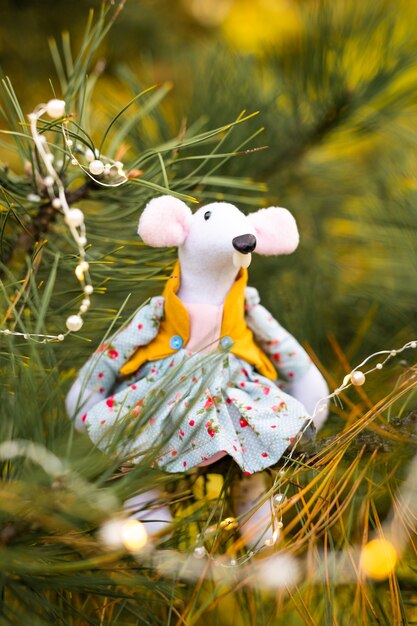 Little mouse toy, symbol of Chinese happy new 2020 in blue dress and new year decoration. Horoscope sign 2020. New Year 's 2020 Symbol. Greeting Christmas card. Front view. Selective focus