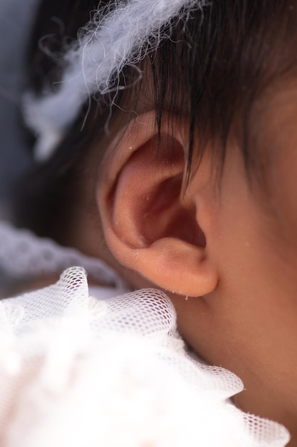 Photo little newborn baby earlobe earring ear preauricular appendix listen