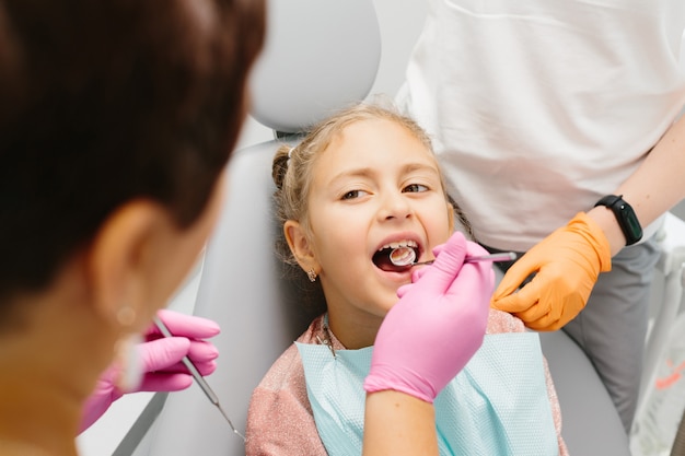 Little patient at the dentist have teeth checkup stomatology clinic