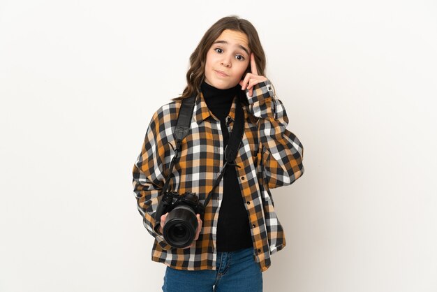 Little photographer girl isolated thinking an idea