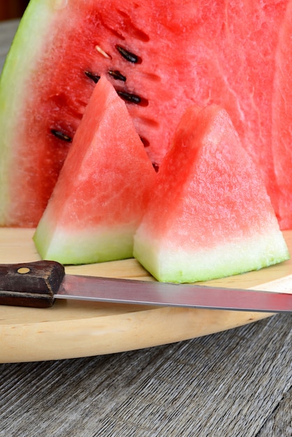 little piece of Red watermelon on cutting board