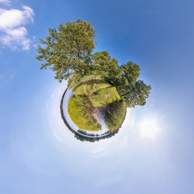 Little planet transformation of spherical panorama 360 degrees Spherical abstract aerial view near river with awesome beautiful clouds Curvature of space