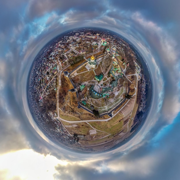 Photo little planet with an orthodox monastery