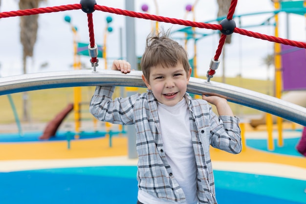 Little preschooler boy on the playground