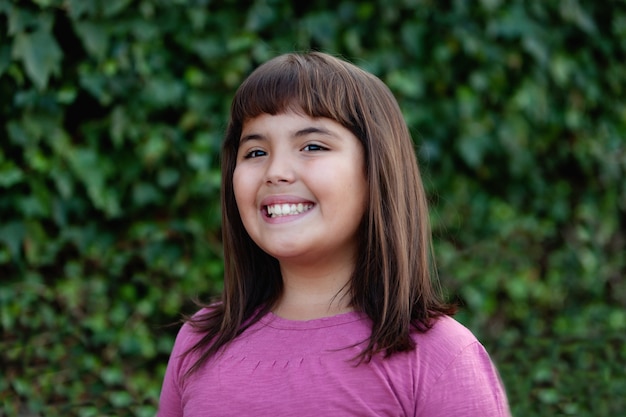 Little preteen girl in park  