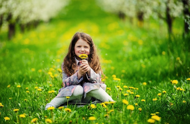 Little pretty girl in the green garden